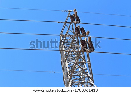 Electricity transmission power lines. The high voltage tower. And background texture.