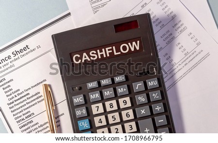 CASHFLOW word on calculator and pen on documents Royalty-Free Stock Photo #1708966795