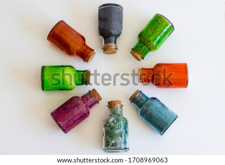 glass bottles with sand from exotic beaches