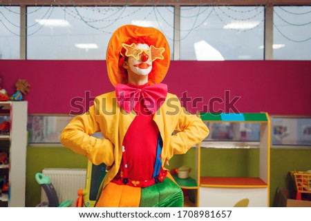 Funny clown in star glasses