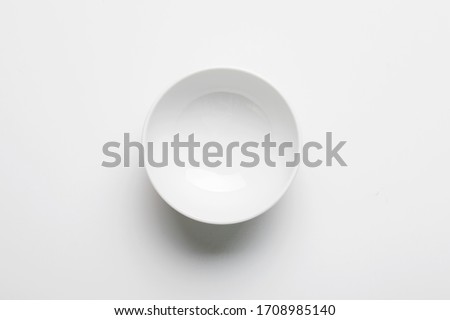 Top view of white empty ceramic dip bowl isolated on white Royalty-Free Stock Photo #1708985140