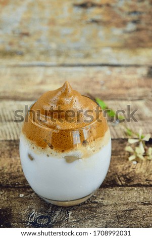 Iced Dalgona Coffee. Viral Whipped Coffee. Selective focus, Wooden Background