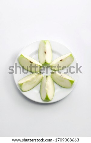 Cut apples on a plate 