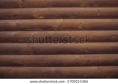 Picture of an old log cabin wall texture. Wood log background.