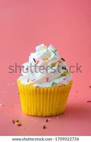 Homemade Birthday cupcake on pink Background.