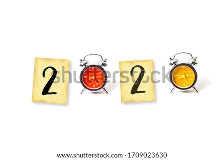2020 text on grunge paper with old retro clock isolated on white background. image for new year 2020 decorative design 