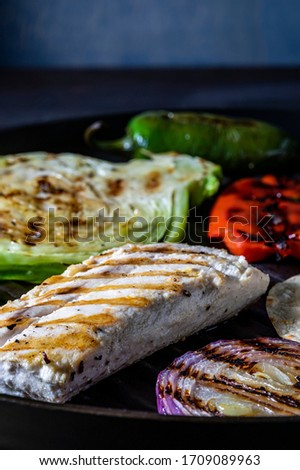 Soft fish taco ingredients. Grilled fish and vegetables.