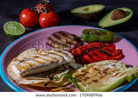 Soft fish taco ingredients. Grilled fish and vegetables.