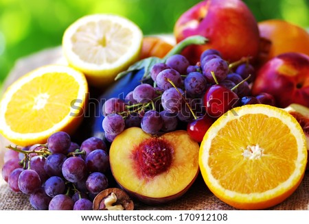 Slices of peach, grapes and citrus fruits Royalty-Free Stock Photo #170912108