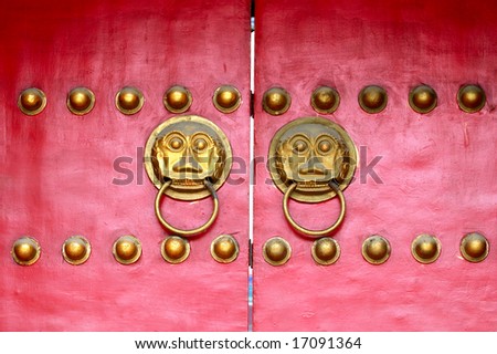 The Chinese red imperial wood door with bronze lion head