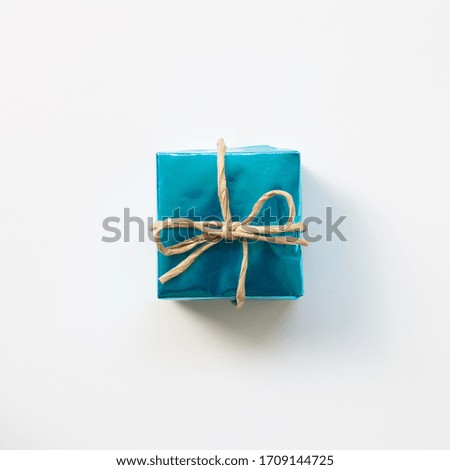 Blue shiny metallic gift box isolated on white background. top view, copy space