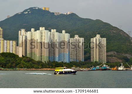 yacht with tourists near hong kong city