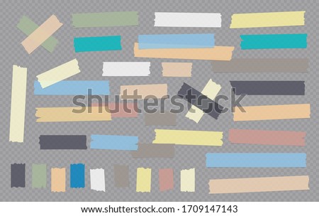 Colorful different size adhesive, sticky, masking, duct tape, paper pieces are on grey squared background Royalty-Free Stock Photo #1709147143