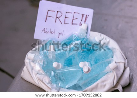 A large amount of blue gel alcohol Is packed in a small bag. Placed in a white cloth bag on the table. For free alcohol gel. for washing hands Anti-virus and anti-bacteria and Covid-19. . Copy space.