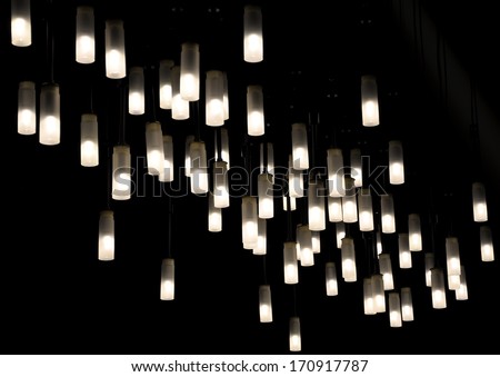 Light fixtures suspended from ceiling  