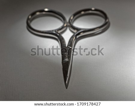 small nail scissors in the spot light