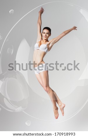 beautiful jumping woman in bubble
