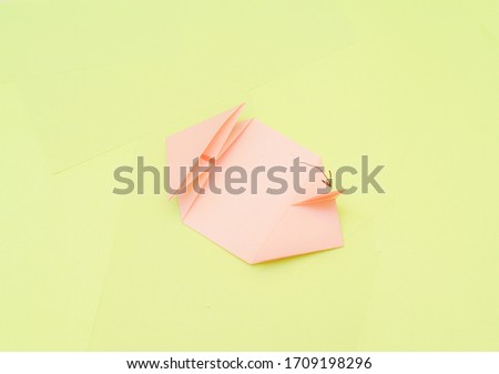 Origami pink heart on a green background, step by step instructions. as great idea for a hand made diy Valentine s Day, Mothers day gift.