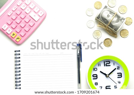 Flatlay picture of fake note, coins, notebook, pen, clock and calculator. Financial crisis after covid-19 outbreak. 
