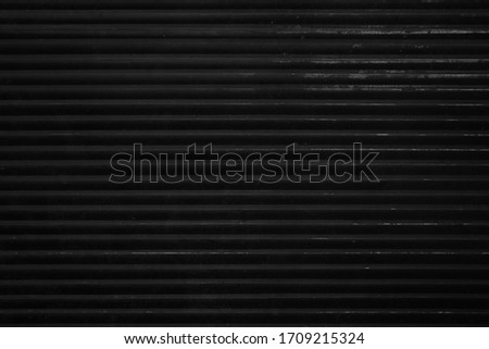 Black grunge striped bacgkround. Old wall. Metal fence texture. Blackboard