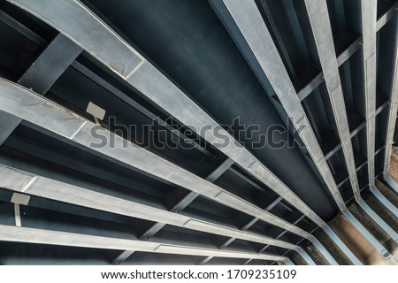 Construction beams of an old railway bridge. Royalty-Free Stock Photo #1709235109