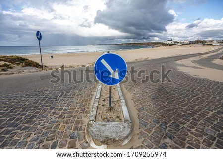 Read sign with sea view at Peniche