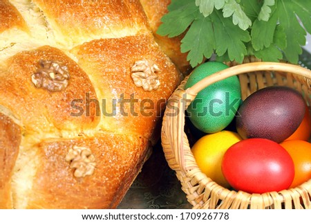 basket of Easter eggs, Easter cake and Geranium 