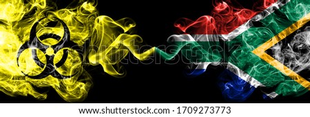Quarantine in South Africa, African. Coronavirus COVID-19 lockdown. Smoky mystic flag of South Africa, African with biohazard symbol placed side by side.