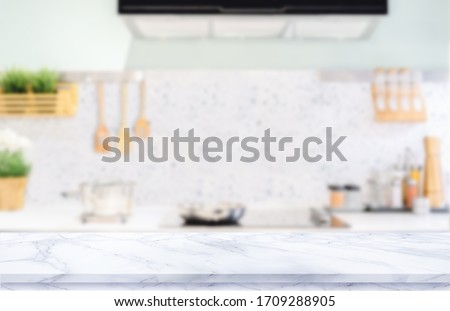 White marble texture  table top on blurred kitchen background Royalty-Free Stock Photo #1709288905