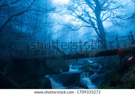 The ruins of a bridge with fog.