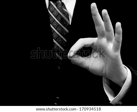 Businessman's hand showing ok sign