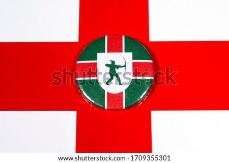 A badge portraying the flag of the English county of Nottinghamshire, pictured over the England flag.