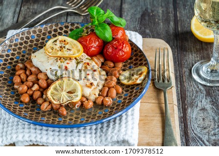 Halibut baked in white wine with borlotti beans and tomatoes 
