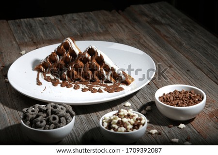 Chocolate Waffle on white plate, wooden table