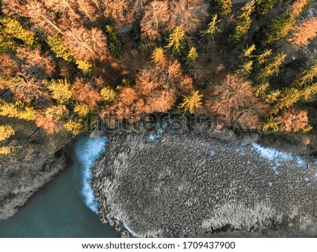 Drone photos of the frozen lake in the middle of the forest, Czech Republic