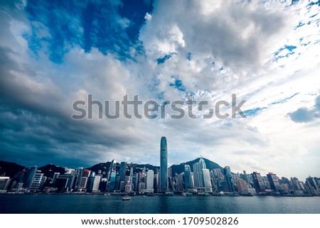 Panorama of Hong Kong City skyline from across Victoria Harbor; with Sunlight effect