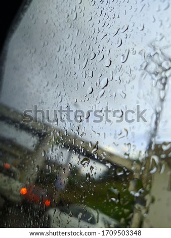 Raindrops in the glass of a car 