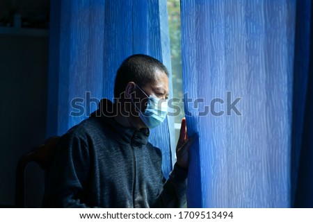 Covid-19 or Coronavirus Situation Virus Concept Mask, Surgical Face Masks, senior Men Wearing Anti-Germ, and Dust Masks, pm.5, coronavirus outbreak.Stressed patient.Social distancing among the family. Royalty-Free Stock Photo #1709513494