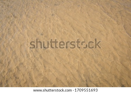 Water surface sand texture on clean beach.