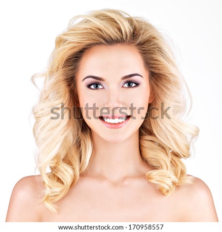 Beautiful woman with long blond curly hair.Isolated on white
