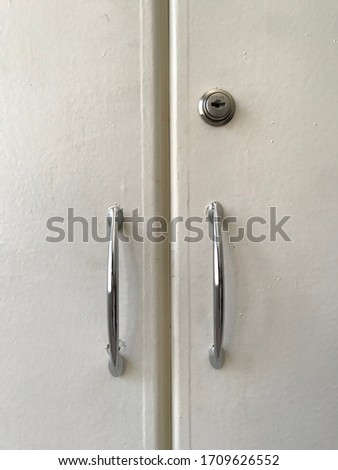 White cabinet handles and key slot