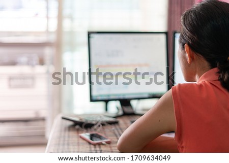 Woman working her job from home by using computer connect to her office. Royalty-Free Stock Photo #1709634049