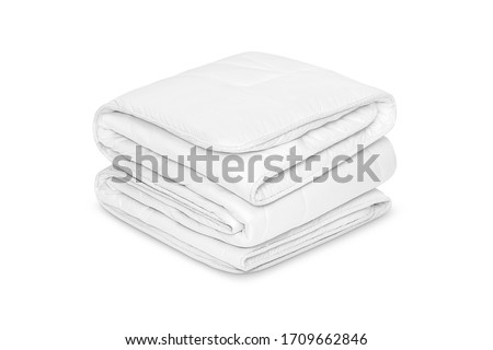 Folded soft white blanket, bedspread or duvet for a comfortable sleep. White blanket folded on a white background. Fabric structure. 3D blanket model. Comfortable sleep. Close up photo