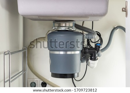 Garbage Disposal under the modern sink, waste chopper concept Royalty-Free Stock Photo #1709723812