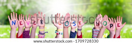 Kids Hands Holding Word Never Lose Hope, Grass Meadow