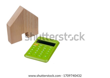House wooden block and calculator isolated on white background