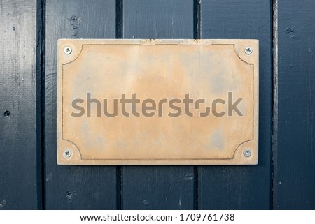 Empty sign with room for text on wooden painted background