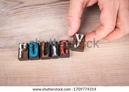 Policy. Entrepreneurship, National Government, Direction and Attitude Concept. Colored wooden letters on a light background