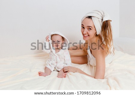 Mom and baby girl after bathing