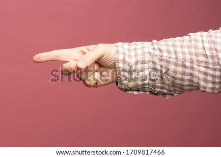 The perfection of an adult hand, with all five fingers, making signs and signals such as non-verbal language, sign and signal language.